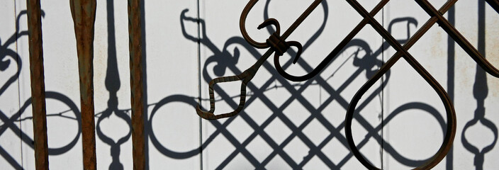Fototapeta na wymiar old rusty wrought iron fence