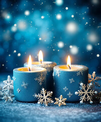 Obraz na płótnie Canvas Christmas blue candles and snowflakes on snow floor, new year burning candle on magic bokeh background with copy space. Winter holidays festive greeting card.