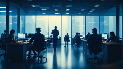 Fototapeta na wymiar Silhouettes of business people working in modern office.