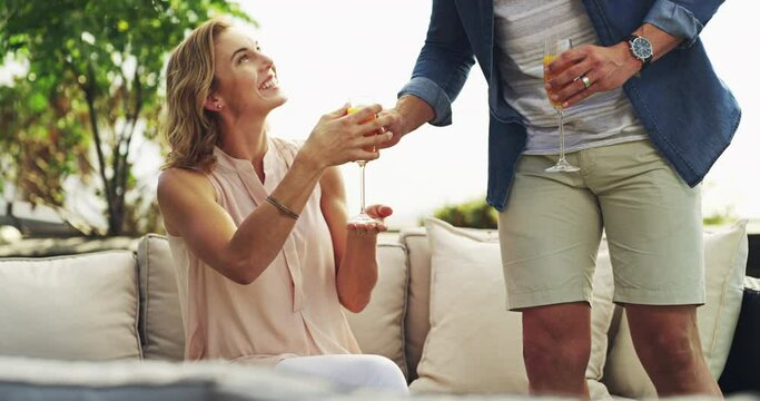 Couple, drinks and relax outdoor on terrace couch with a smile from love, support and care. Happy, backyard and home with marriage and calm people together with mimosa and break on sofa with alcohol