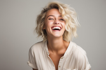 portrait of a blonde woman laughing - obrazy, fototapety, plakaty