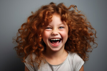 curly-haired redhead girl laughing joyfully