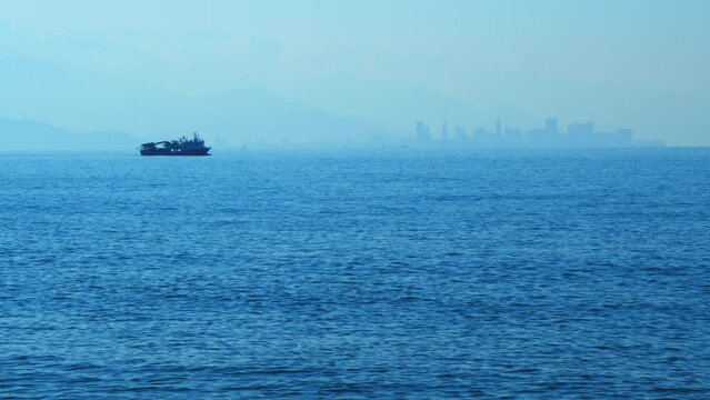 Fishing Vessel Sailing On Waves In Sea To Fish. Sea Summer Ocean Daylight Nature Background. Real time.