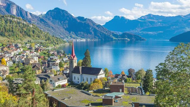 Time lapse, panoramic view on the town in mountains next to the lake. Weggis, lake Lucerne, Vierwaldstättersee, canton of Lucerne in Switzerland.