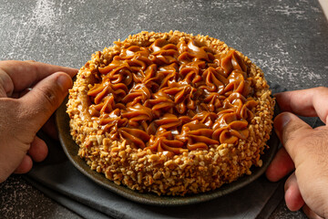 churros cake with dulce de leche on top. sweet cake dessert