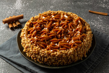 churros cake with dulce de leche on top. sweet cake dessert