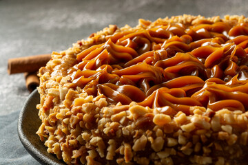 churros cake with dulce de leche on top. sweet cake dessert