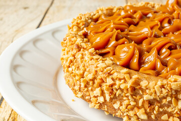 churros cake with dulce de leche on top. sweet cake dessert