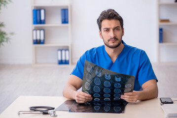 Young male doctor radiologist working in the clinic