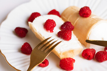 Sweet dessert, ice cream with raspberries on white plate
