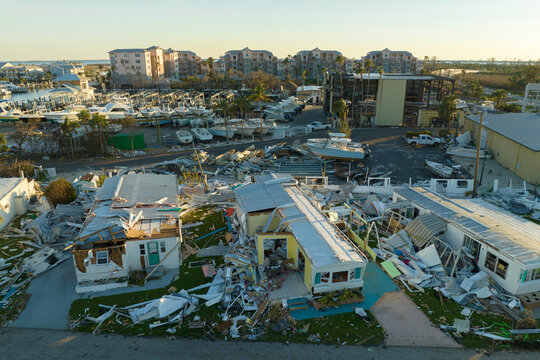 Badly damaged mobile homes after hurricane Ian in Florida Southwest region residential area. Consequences of natural disaster