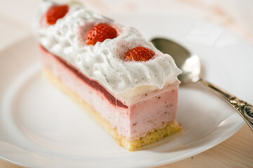 Delicious sweet cake close-up selective focus, cake with white protein cream decorated with strawberries