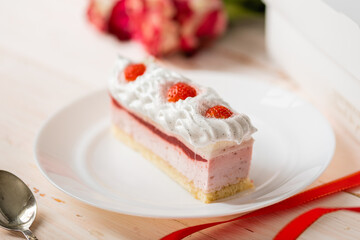 Obraz na płótnie Canvas Delicious sweet cake close-up selective focus, cake with white protein cream decorated with strawberries