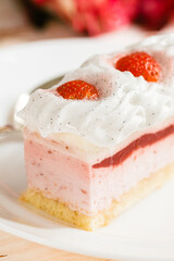 Delicious sweet cake close-up selective focus, cake with white protein cream decorated with strawberries