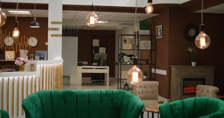Empty luxury lounge area in holiday retreat decorated in modern fashion, check in reception front...