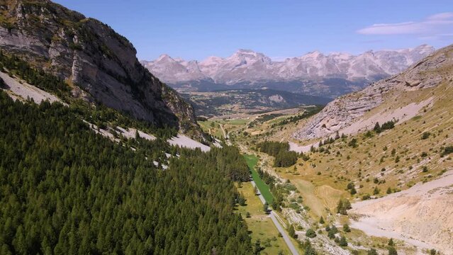 Aerial view of valley and Col du Noyer looking towards mountains of the Devoluy Massif in summer. Hautes-Alpes (Alps), France