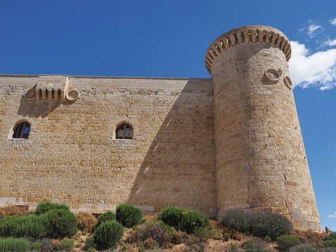 Side view of 15th century castle of the Sarmiento, Fuentes de Valdepero, Spain. Stone masonry walls keep a height of 22 meters and the thickness of its walls is the largest of the Spanish castles.