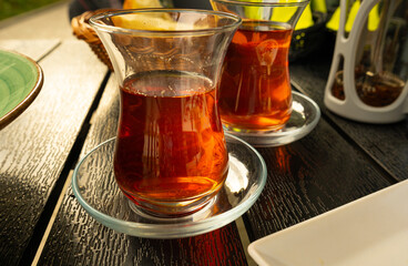 Turkish Tea on a Street Cafe Table, Arabic Cup in Restaurant, Black Tea Drinking in Turkish Cup