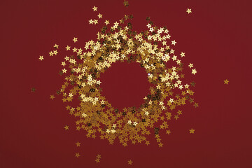 Round gold frame or border of random scatter golden stars