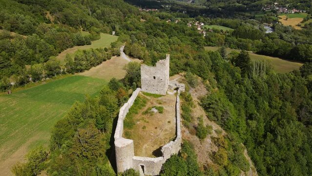 Aerial view of ruins of Saint-Firmin castle (14th century medieval construction) at the entrance of Valgaudemar valley and Ecrins National Park. Hautes-Alpes (Alps). France