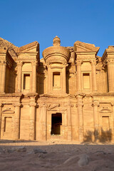 Low angle view of famous Ad Deir monastery in the historic and archaeological city of Petra in Jordan