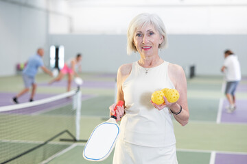 Portrait of an elderly positive woman after an active game of pickleball