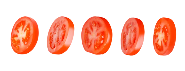 Fotobehang Flying tomatoes cut into circles. Tomatoes, tomatoes, cut, fresh tomatoes. Isolated. Horizontally. © MM