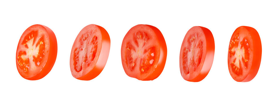 Flying tomatoes cut into circles. Tomatoes, tomatoes, cut, fresh tomatoes. Isolated. Horizontally.
