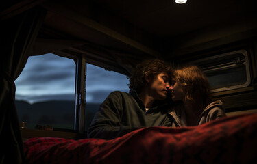 happy couple hug and kiss in camping trailer, romantic adventure and road trip of young man and woman