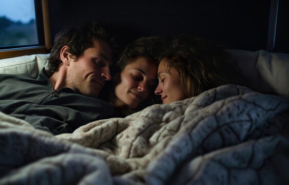 polyamorous family of three people hugging in bed, love of three people, non monogamy concept