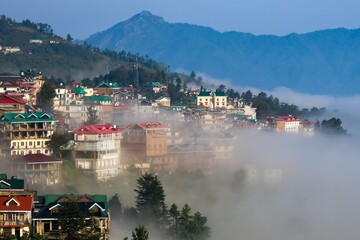 Scenic shot capturing the enchanting Shimla city perched on the edge of Himachal Pradesh, partially...