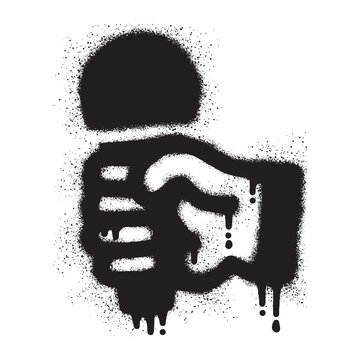 Graffiti of a hand holding a microphone with black spray paint