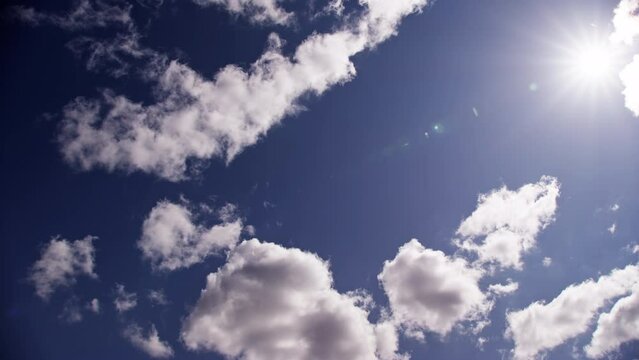 The Bright Sun With Drifting White Clouds