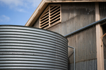 Fototapeta premium Water tank corrugated iron store shed old industrial sustainable reuse recycle