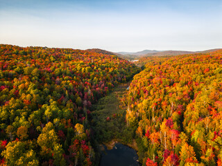 Aerial view of winding river in Laurentian mountains, Quebec, Canada during the fall foliage
