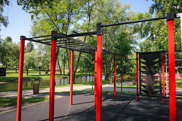 Fototapeta na wymiar Empty outdoor gym with exercise equipment in park
