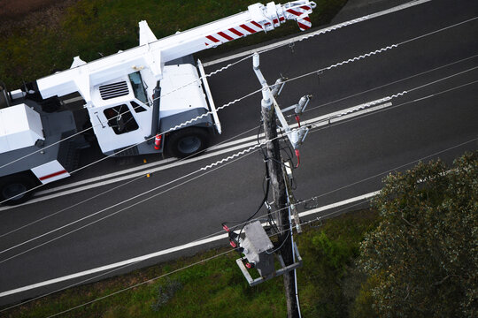 Aerial View of a Maintenance Crane Next to a Telephone Pole
