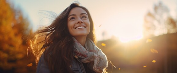Fototapeta premium A woman smiling at sunset