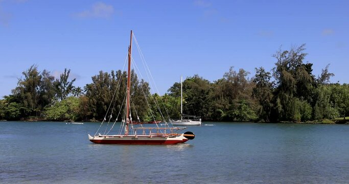Hilo Hawaii sailboat in tropical bay pan. Hilo Hawaii is located on the Big Island and is a tourist destination. Tropical with parks, marina, airport and ship port.