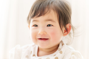 Fototapeta premium 赤ちゃんの笑顔 ポートレート