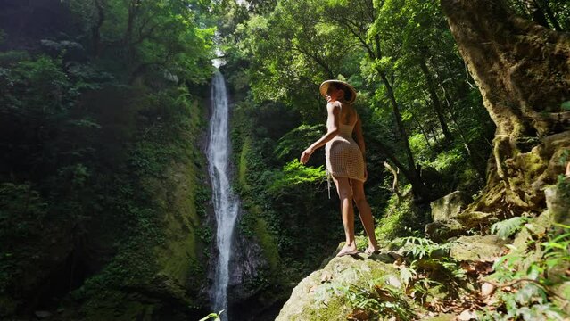 Model Under The Sunlight Near Forest Fall