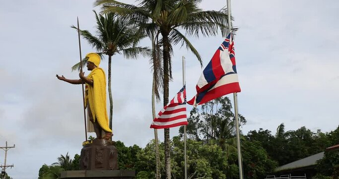 King Kamehameha statue Hawi Hawaii flags side. Kamehameha the Great. Ruler credited with unifying the Hawaiian Islands. Bronze statue cast in 1880 to honor the Hawaiian Islands and their ruler.