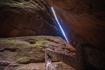 The light coming through the rocks in a cave in Wuyishan area, Fujian, China