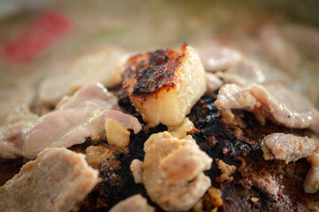 Thailand barbecue Grill Meat on hot pan called Moo-Kata. Thai style BBQ