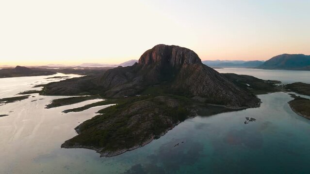 Torghatten is a mountain on Torget island in Nordland county, Norway. It is known for its characteristic hole, or natural tunnel, through its center.