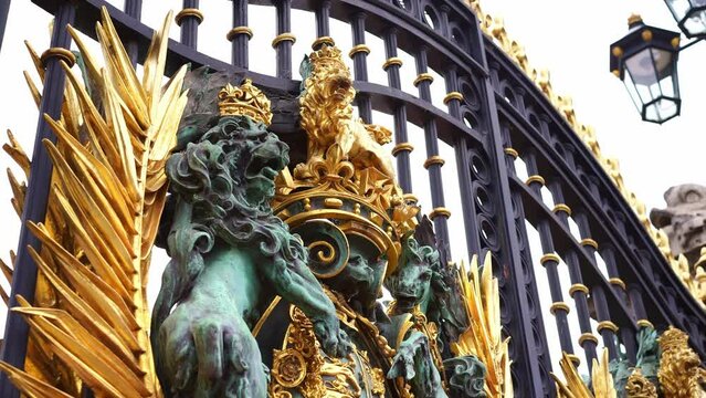 Gate at Buckingham Palace, London, England. Historic tourism destination, traditional landmark, travel in England. 