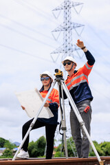 Engineer use theodolite equipment and Blueprint surveying construction worker on Railway site..