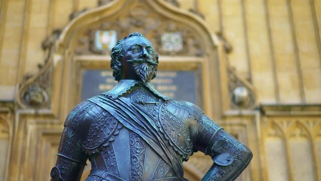 Statue of William Herbert, Earl of Pembroke in front of The Divinity School. University of Oxford. Historic landmark. Tour for visitors and students on campus, England. 
