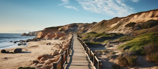Wooden walkway leading to the beach in Algarve, Portugal - Powered by Adobe