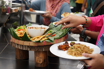 Various kinds of menus are served in  buffet manner which is usually at a meeting, party, wedding or family gathering. Traditional culinary like chicken, fish, tempeh, tofu, potato, vegetable and egg.